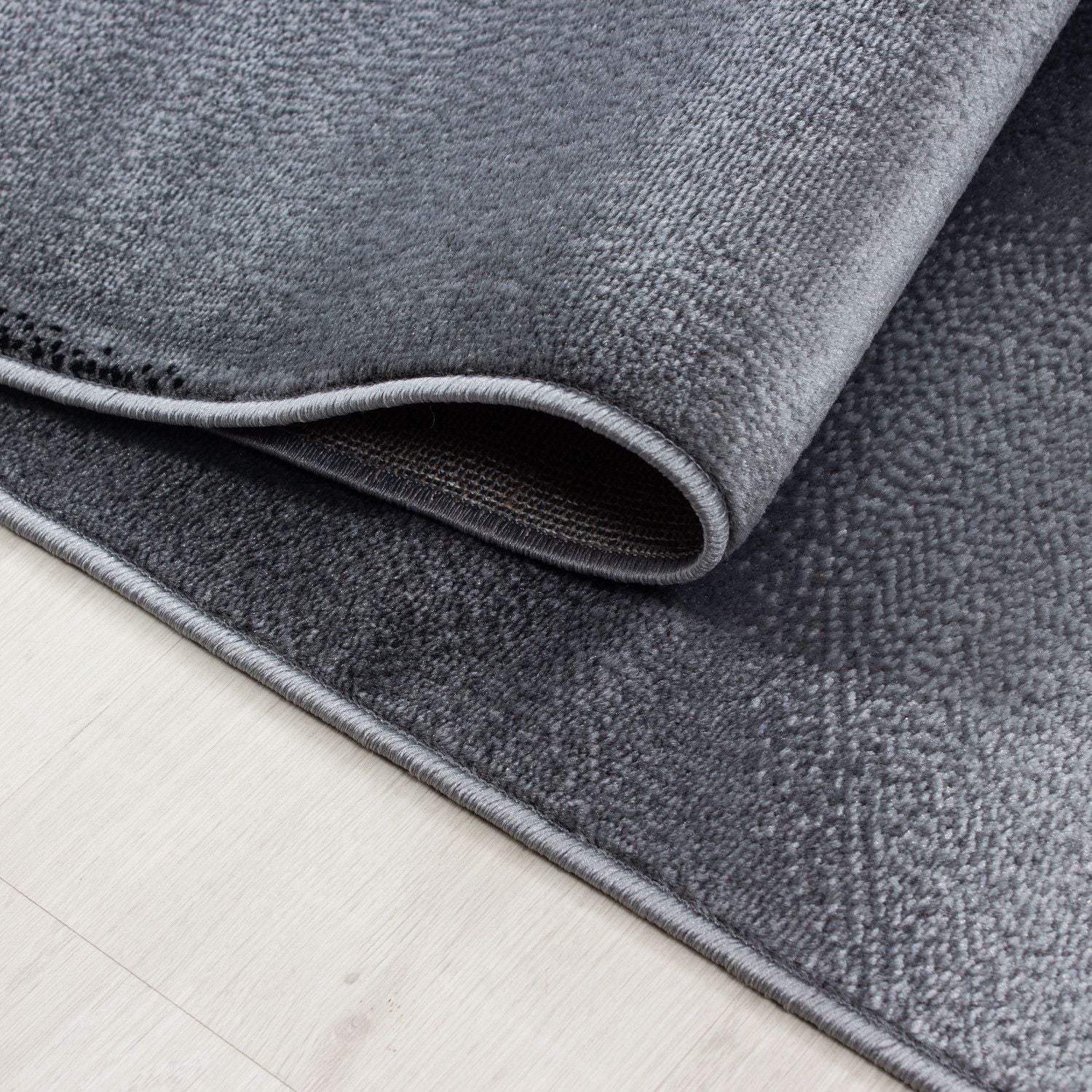 Plus Abstrakter Kurzflorteppich in Schwarz mit Wellen - Image 5